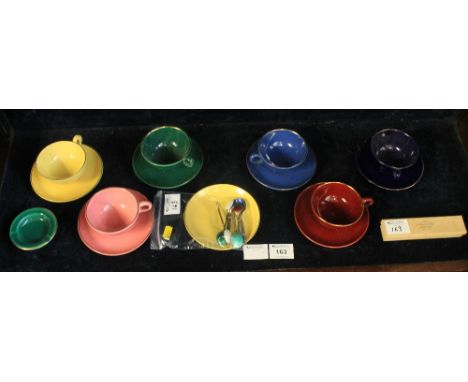 Set of six coloured tea cups and saucers together with ashtray, additional saucer and silver and enamel coffee spoons, stampe