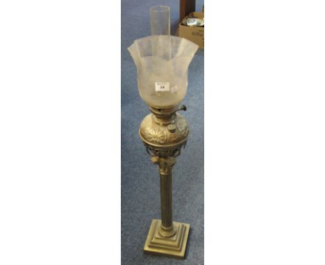 Early 20th Century brass oil lamp lacking burner unit, having repousse brass reservoir on corinithian column base with froste