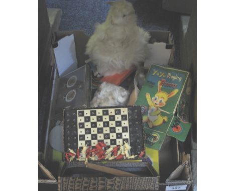 Box of assorted collectables to include Pelham puppets, yoyo playing bunny, playing cards, combination safe, boxed chess boar