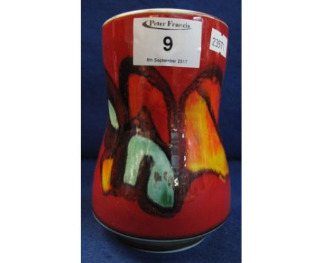 Poole pottery waisted red ground abstract decorated cylinder vase.  Printed marks with number 83.  15cm high.(B.P. 24% incl. 