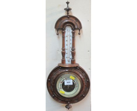 Small walnut aneroid wheel barometer with ceramic thermometer scale. (B.P. 24% incl. VAT)