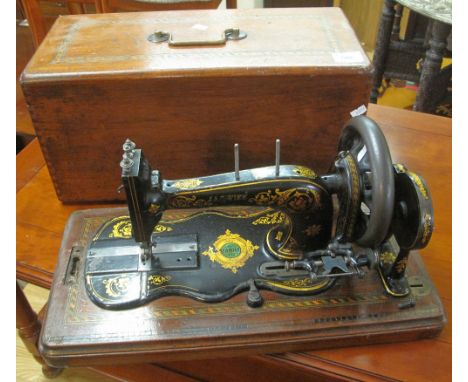 Vintage late Victorian 'Family' hand sewing machine in tunbridge banded box case. (B.P. 24% incl. VAT)