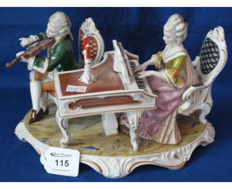 Kunst porcelain figural group of male and female playing the violin and piano.(B.P. 24% incl. VAT)   CONDITION REPORT:  No ob