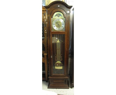 Modern oak longcase clock with brass face and large brass pendulum. (B.P. 24% incl. VAT)   CONDITION REPORT:  3 brass weights