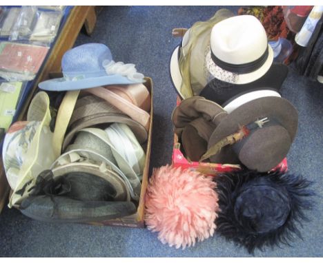 Two boxes of vintage ladies hats to include a variety of straw hats, two feather hats, a brown wide brimmed wool hat with fea