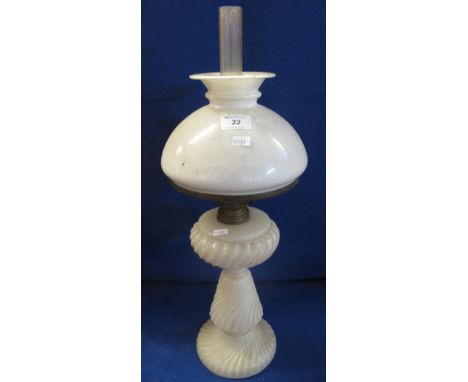 Moulded white glass oil lamp with white glass shade and clear chimney.  59cm overall.  (B.P. 24% incl. VAT)   CONDITION REPOR