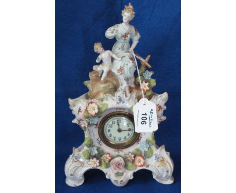German porcelain figural mantle clock with painted and applied floral decoration. Back winding movement. (B.P. 24% incl. VAT)