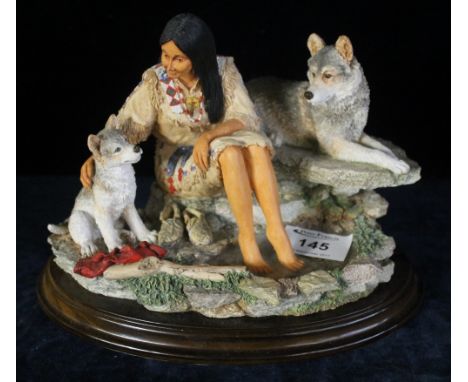 Country artist model of a Native American woman with wolf and cub on naturalistic oval base and plinth.(B.P. 24% incl. VAT)
