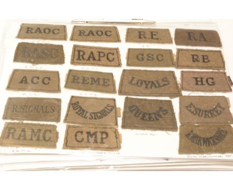 A collection of approximately 250 British cloth shoulder titles, to include: Corps of Military Police, Queen's Regiment, Gene