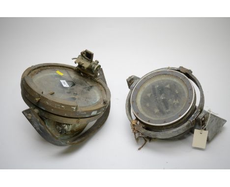 A ship's compass, in 25.5cms brass weatherproof casing, fitted prism sight, on swivel mount; together with an 18cms ship's co