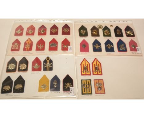 A collection of 33 Dutch collar badges on boards, to include: Infantry, Training Reserve Officer, Air Supply Corps, Training 