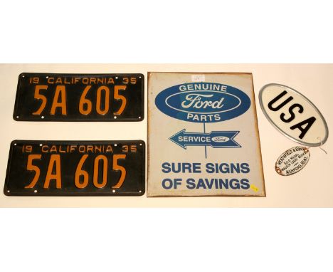 A pair of California licence plates, inscribed "1939 No. 5A 605", orange enamel on black, each 16 x 35cms; together with an o