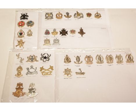 A collection of 36 African cap badges, to include: Kenyan Engineers, Kenyan Ordnance Corps, Kenyan Rifles, Kenyan Pay Corps, 