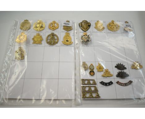 A collection of 26 Australian metal cap badges, to include: Australian Commonwealth Military Forces badge, Australian Army Pu