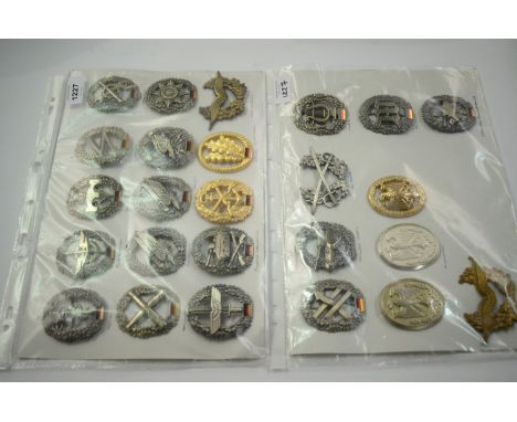 A collection of 25 German Bundeswehr cap badges, to include: Medical Quartermaster Engineer, Jager Elite Infantry, Army Aviat