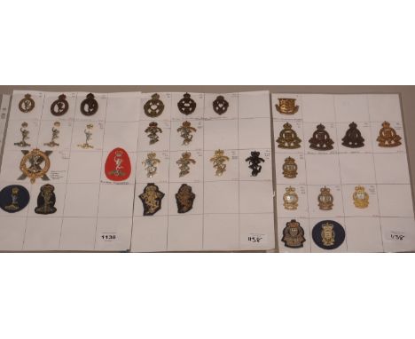 A collection of 32 Military Corps badges, to include: The Royal Corps Signals, The Royal Electric and Mechanical Engineers, T