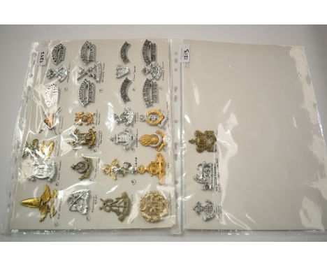A collection of 32 Indian and Pakistani cap badges, to include: Air Defence Corps, Army Rangers, 31st Cavalry Regiment, 4th C