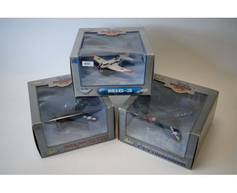 Air Legends 1:48 scale diecast aircraft by Yat Ming: MiG-3; F6F-5N Hellcat; and P-47D Thunderbolt, in original packaging. (3)