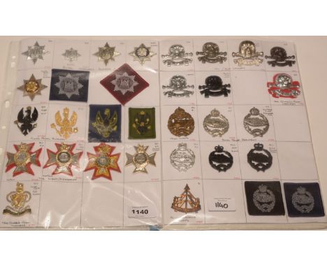 A collection of 33 Cavalry Regiment cap badges, to include: a hallmarked silver Royal Tank Regiment cap badge dated 1940; tog