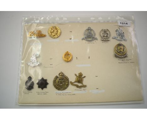 A collection of Indian and Pakistani cap badges, to include: East Bengal Regiment, Bangladesh Army, Madras RET, Indian Electr
