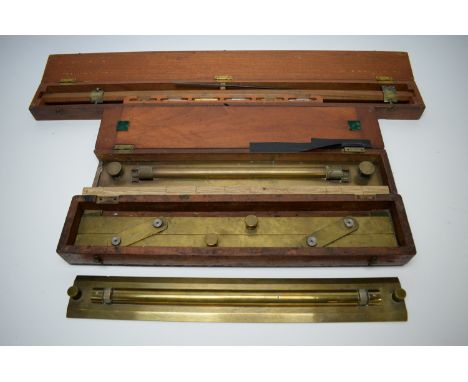 A draughtsman's 23in. beam compass MkII; and two brass parallel rules, in wooden boxes with Ministry of Defence markings; tog