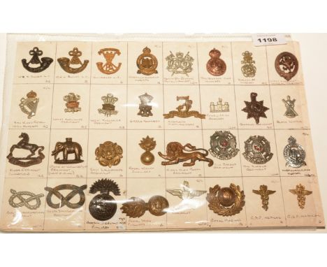 A collection of 32 British Military collar badges, to include: Somerset Light Infantry, Northumberland Hussars, West Yorkshir