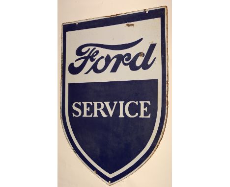 A 1930's "Ford" enamel sign, double-sided, shield-shaped, inscribed in blue enamel on white surface, 85 x 60cms.