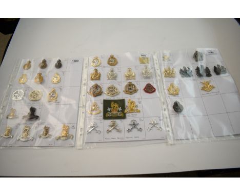 A collection of 43 British cap badges, to include: Army Catering Corps, Small Arms School Corps, Royal Army Veterinary Corps,