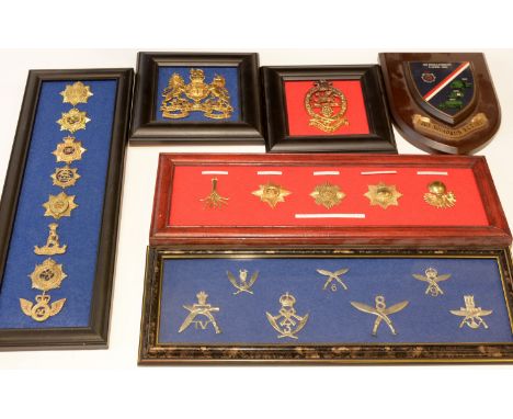 A collection of 8 framed cap badges and a Disbandment plaque, to include: Badges of Cpl J. Mcbeth 263 Sqd, 160 Rg. Royal Corp