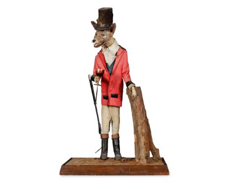 TAXIDERMY ANTHROPOMORPHIC FOX   20TH CENTURY modelled standing dressed in hunting attire, on a rectangular wood plinth base(9