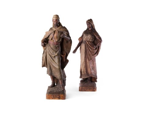PAIR OF GOLDSCHEIDER PAINTED TERRACOTTA FIGURES LATE 19TH CENTURY of an Arab warrior and maiden, impressed marks to lower rea