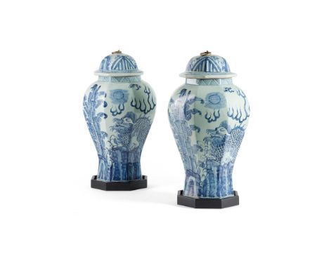 PAIR OF CHINESE BLUE AND WHITE PORCELAIN BALUSTER COVERED JARS 20TH CENTURY each of octagonal section, decorated with mythica