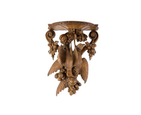 CARVED FRUITWOOD WALL BRACKET   LATE 19TH CENTURY carved with hanging game, fruit and flowers on a moulded base, with green v