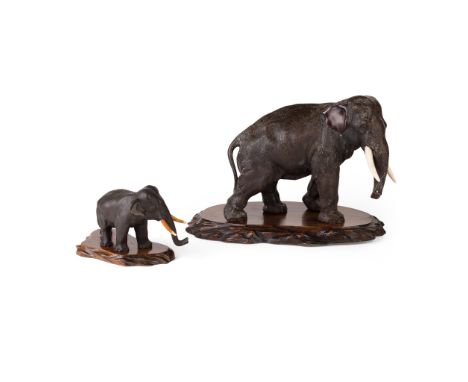 Y TWO JAPANESE BRONZE FIGURES OF ELEPHANTS MEIJI PERIOD, LATE 19TH CENTURY both modelled in a striding pose with sideways tru