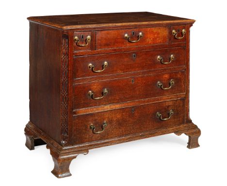 EARLY GEORGE III OAK CHEST OF DRAWERS   MID 18TH CENTURY with a moulded rectangular top, the top drawer flanked by two short 