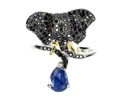 A 925 silver elephant shaped ring set with black spinel, pear cut sapphire and ruby eyes, (M).