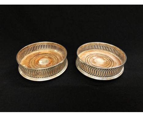 Pair Silver Decanter Coasters on turned wooden bases, JB Ltd., London (2)  CONDITION REPORT 