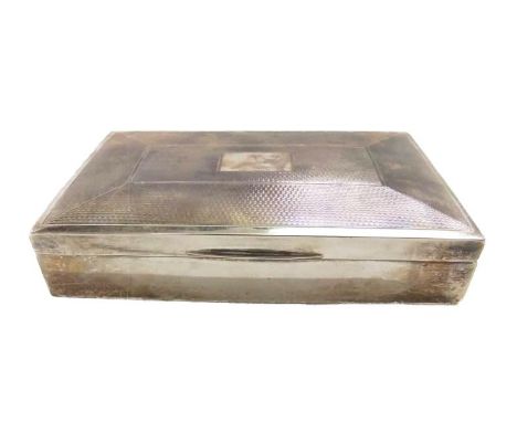 Engine Turned Cigarette Box with hinged lid, plain body, weighted base, vacant cartouche, adjustable interior, Birmingham 196