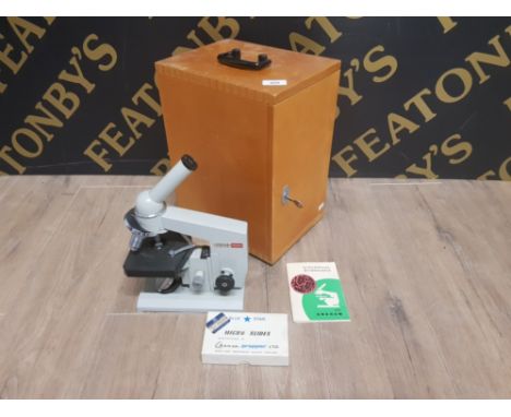 BOXED BIOLOGICAL MICROSCOPE