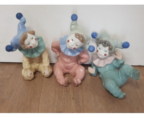 A SET OF 3 NAO BY LLADRO CLOWN FIGURINES