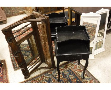 A pair of black painted bedside tables in the French manner, a brass double bed head, an oak wall mounted luggage rack with c