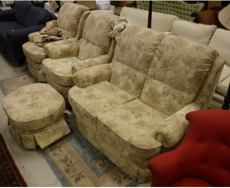 A modern upholstered three piece suite by G Plan circa 2008, comprising two seat sofa and two chairs and a pouffe in a beige 