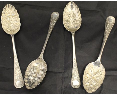 Two pairs of Victorian embossed silver fruit spoons (by Walker & Hall, Sheffield 1897 and by William Hutton & Son Ltd, London