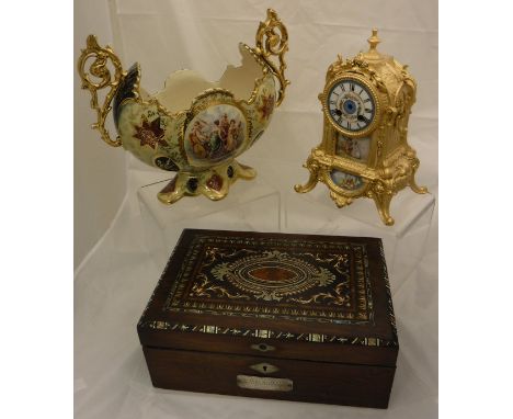 A rosewood and inlaid writing slope, the inlaid top with amboyna, white metal and mother of pearl, with a white metal plaque 