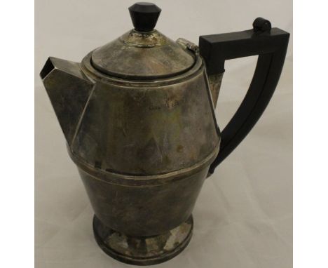 An Art Deco silver water jug of typical form with ebonised handle (by A L Davenport, Birmingham 1932), 10.8 oz including hand