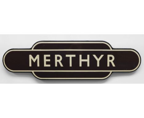 A BRITISH RAIL'TOTEM' ENAMEL SIGN FOR MERTHYR TYDFIL in typical brown, cream and black livery, of rounded-edge form, 93cms lo