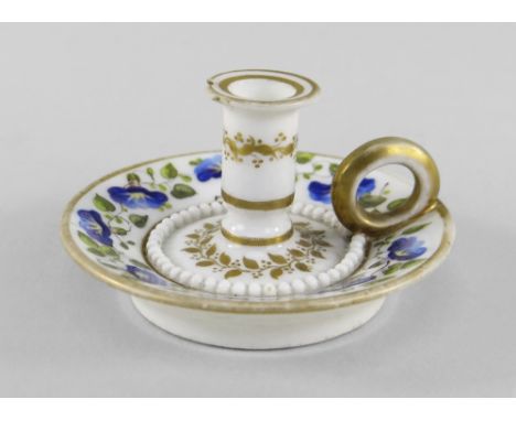 A RARE SWANSEA PORCELAIN MINIATURE TAPERSTICK of circular form with ring handle and stepped nozzle surrounded by ring of bead