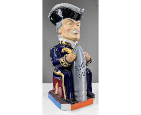 A WILKINSON TOBY JUG OF DAVID LLOYD GEORGE DESIGNED BY SIR FRANCIS CARRUTHERS GOULD commemorating WWI, holding a grey artille