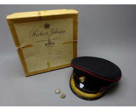 Yorkshire Volunteer Regiment officer's peaked cap with badge and buttons and pair of shoulder badges, formerly belonging to M