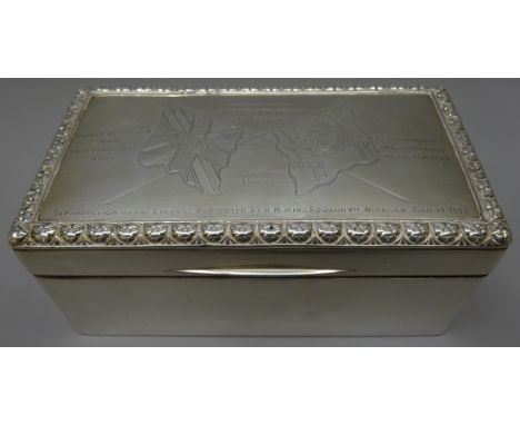 Edwardian silver presentation rectangular cigarette box, the slightly domed hinged lid engraved with crossed flags colours an